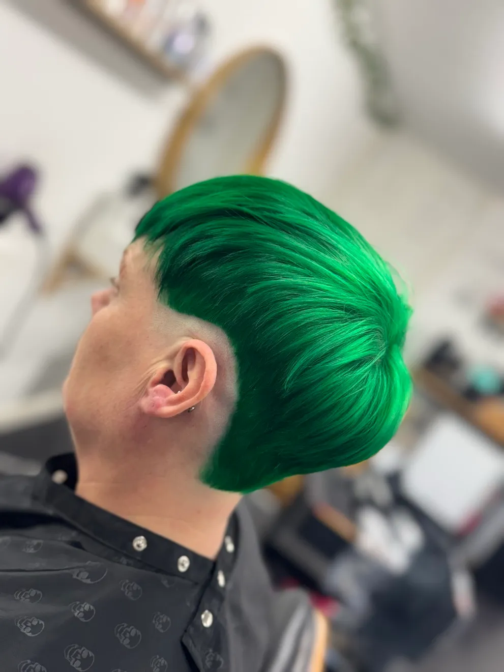 Emerald green pixie — Vivid green on a short cut with a tapered undercut