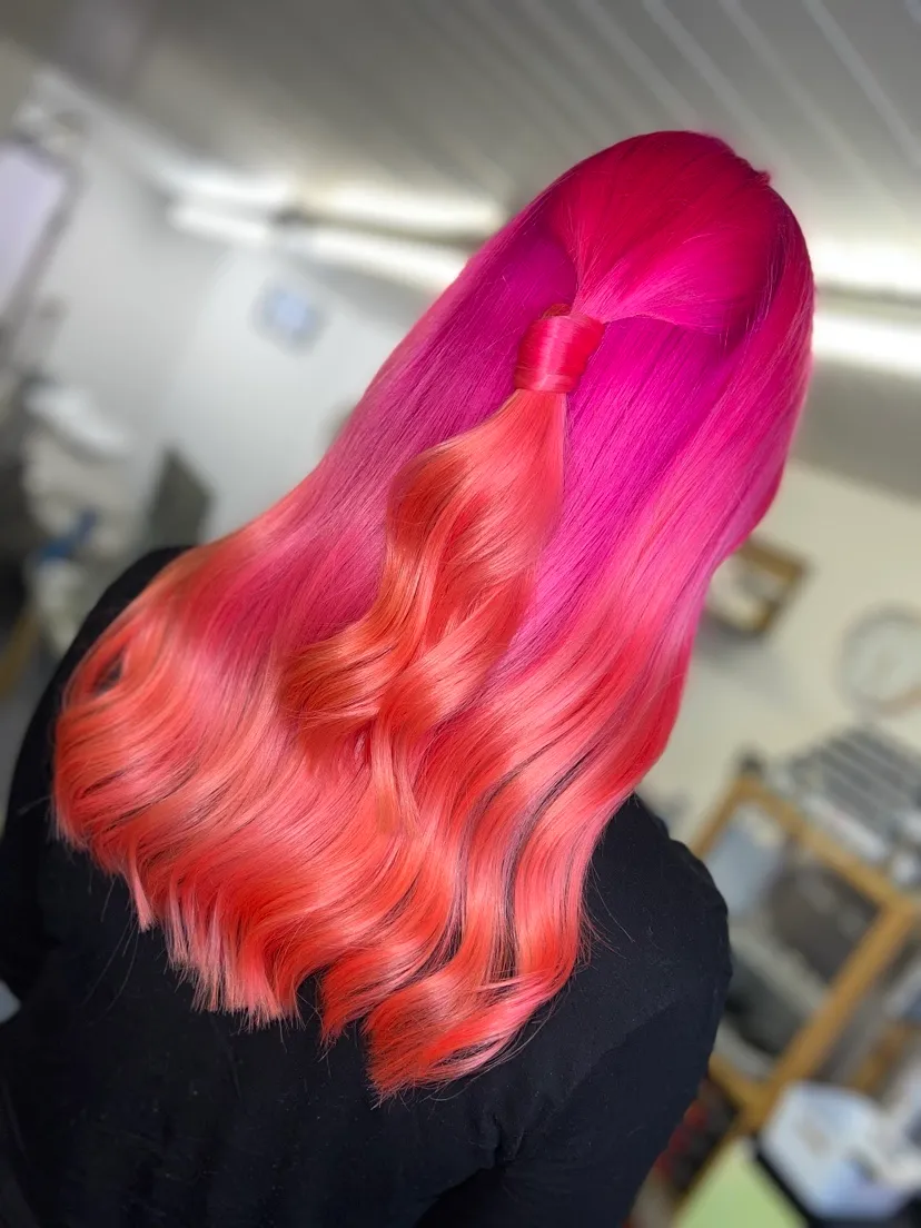 Vivid colour blended through the lengths and styled into waves